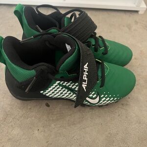 Boys green Nike cleats